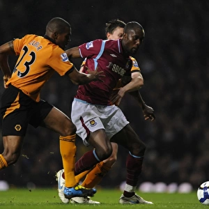 Determined Defenders: Zubar and Foley's Chase Down of Carlton Cole - Wolverhampton Wanderers vs. West Ham United