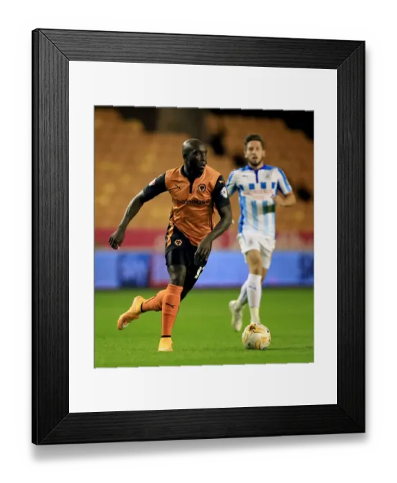 Framed Print : Determined Yannick Sagbo's Brilliant Performance: Wolves vs Huddersfield Town in Sky Bet Championship Framed Print : Determined Yannick Sagbo's Brilliant Performance: Wolves vs Huddersfield Town in Sky Bet Championship