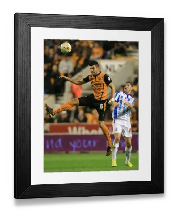 Framed Print : Batth's Dominance: Wolves vs Huddersfield Town - Championship Showdown at Molineux (Danny Batth Outjumps Grant Holt) Framed Print : Batth's Dominance: Wolves vs Huddersfield Town - Championship Showdown at Molineux (Danny Batth Outjumps Grant Holt)