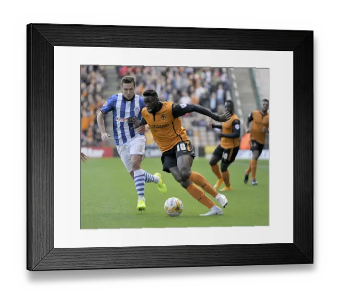 Framed Print : Wolverhampton Wanderers vs Wigan Athletic: A Championship Showdown - Sako vs Cowie's Intense Battle for Possession Framed Print : Wolverhampton Wanderers vs Wigan Athletic: A Championship Showdown - Sako vs Cowie's Intense Battle for Possession