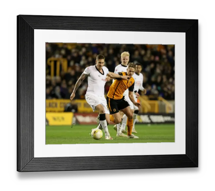 Framed Print : Intense Battle for Championship Supremacy: Wolves vs Derby County