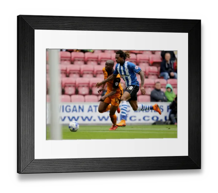 Framed Print : Wolverhampton Wanderers vs. Wigan Athletic: Intense Clash Between Benik Afobe and Gaetan Bong in Sky Bet Championship Framed Print : Wolverhampton Wanderers vs. Wigan Athletic: Intense Clash Between Benik Afobe and Gaetan Bong in Sky Bet Championship