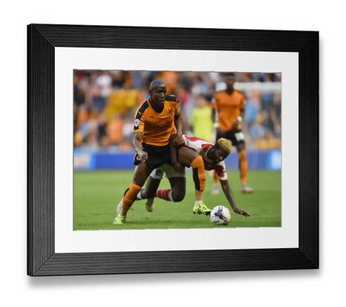 Framed Print : Wolverhampton Wanderers vs Newport County: Battle for the Ball in Capital One Cup First Round