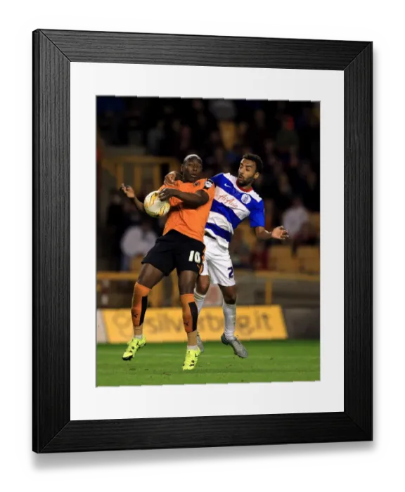 Framed Print : Intense Rivalry: Afobe vs. Perch Battle in Wolves vs. QPR Championship Clash at Molineux Framed Print : Intense Rivalry: Afobe vs. Perch Battle in Wolves vs. QPR Championship Clash at Molineux