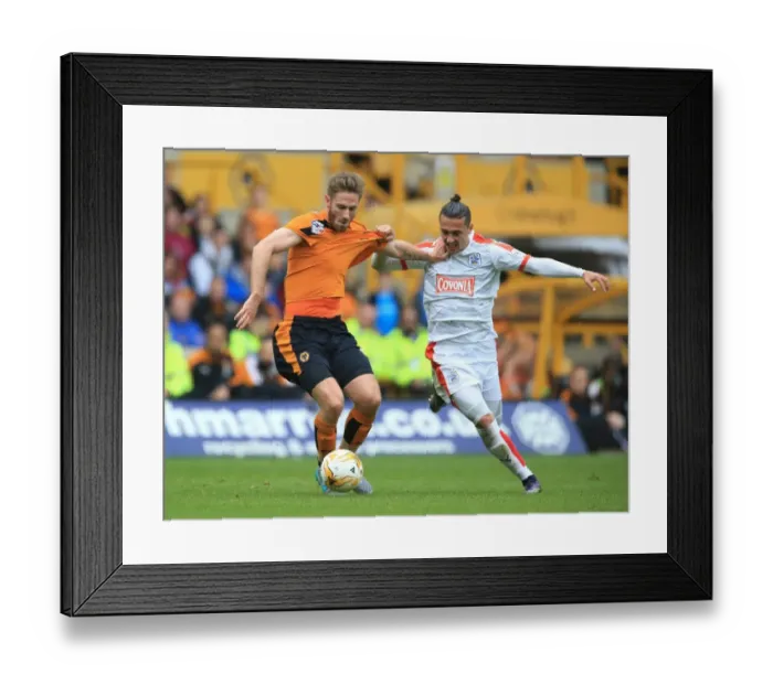 Framed Print : Championship Showdown: Intense Battle Between Henry and Davidson at Molineux - Wolves vs. Huddersfield