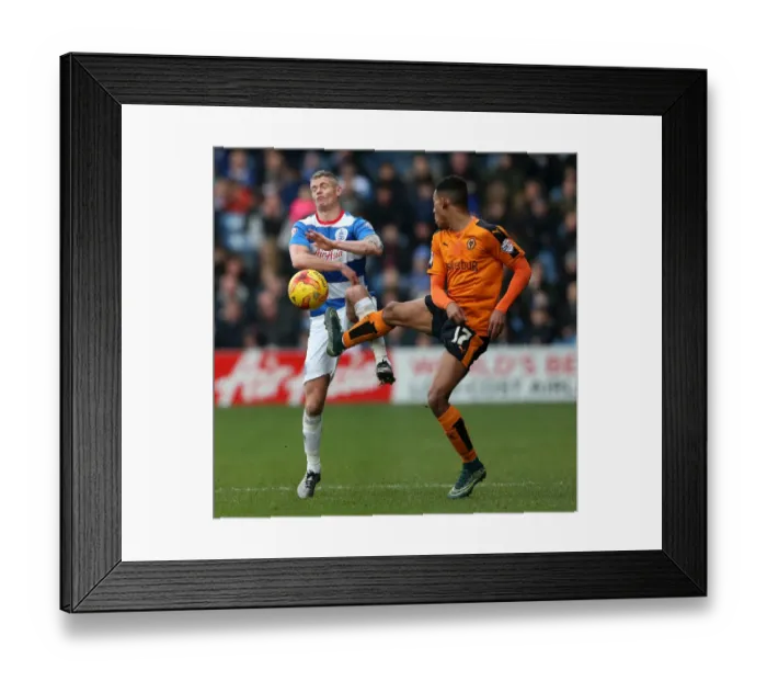 Framed Print : Van La Parra vs. Konchesky: Intense Battle in Wolverhampton Wanderers vs. Queens Park Rangers Championship Clash