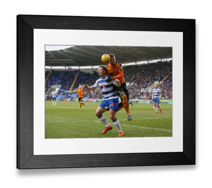 Framed Print : Wolves vs. Reading: Intense Aerial Battle Between Yann Kermorgant and Matt Doherty in Sky Bet Championship