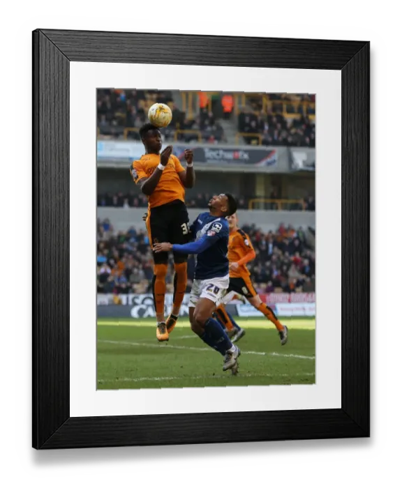 Framed Print : Wolves vs Birmingham City: Intense Battle for the Ball between Kortney Hause and David Davis