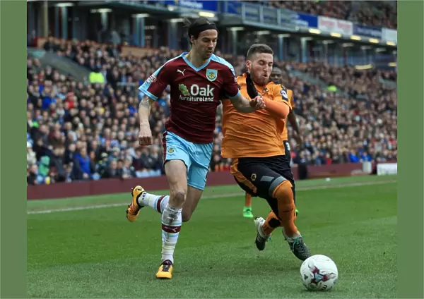Burnley vs. Wolves: Intense Battle for the Ball between George Boyd and Matt Doherty at Turf Moor