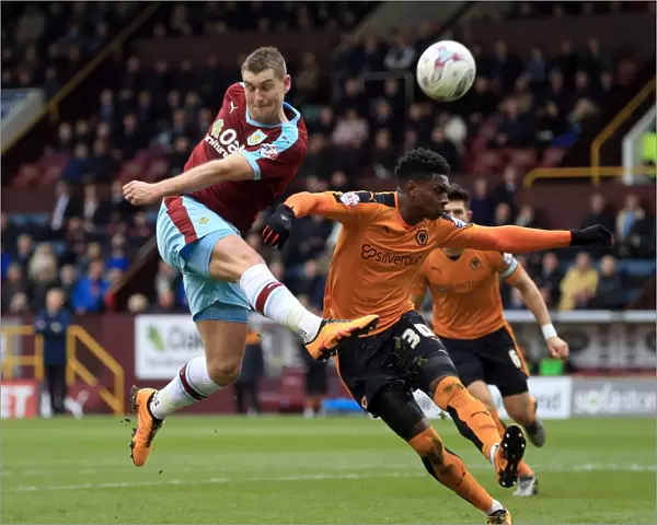Burnley's Sam Vokes Tries to Score Past Wolves Kortney Hause in Sky Bet Championship Match
