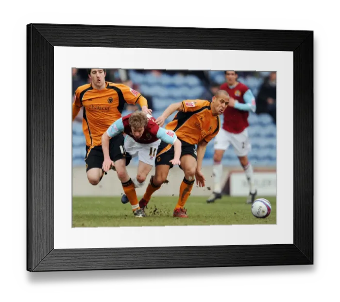 Framed Print : Wade Elliott vs Nigel Quashie: Intense Battle in Burnley vs Wolves Championship Clash at Turf Moor (2009) Framed Print : Wade Elliott vs Nigel Quashie: Intense Battle in Burnley vs Wolves Championship Clash at Turf Moor (2009)