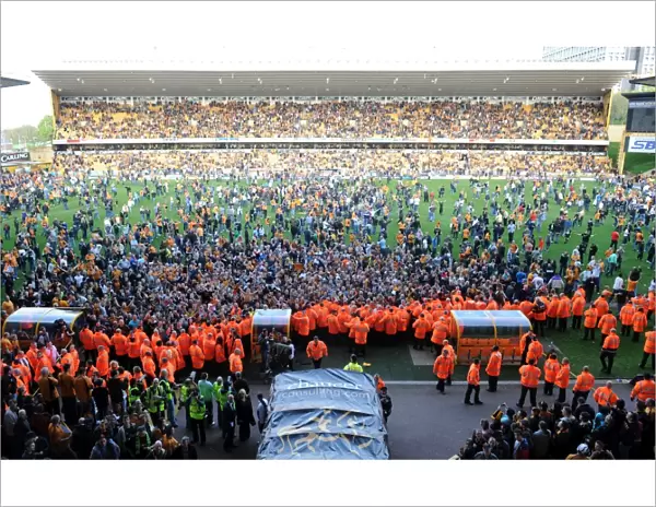 Jubilant Wolves Fans Celebrate Promotion to Premier League on Molineux Pitch (2009)