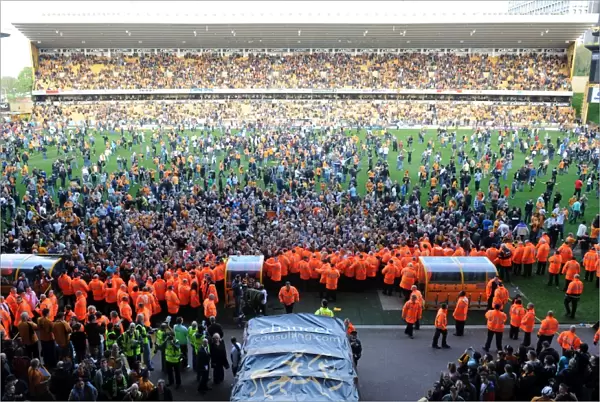 Jubilant Wolves Fans Celebrate Promotion to Premier League on Molineux Pitch (2009)