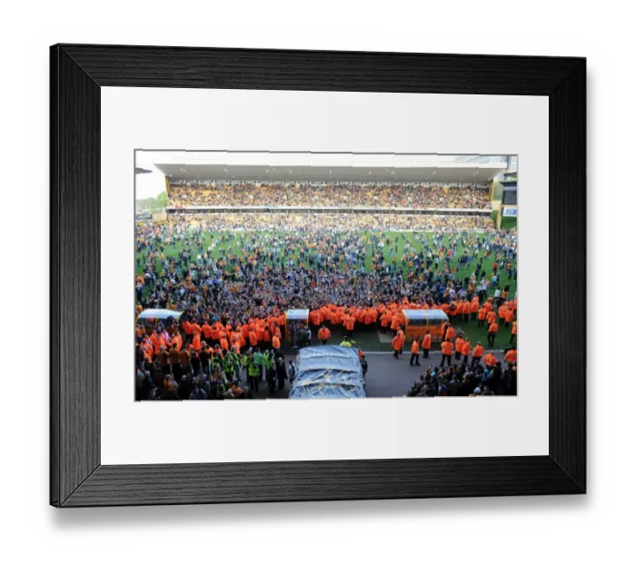 Framed Print : Jubilant Wolves Fans Celebrate Promotion to Premier League on Molineux Pitch (2009) Framed Print : Jubilant Wolves Fans Celebrate Promotion to Premier League on Molineux Pitch (2009)