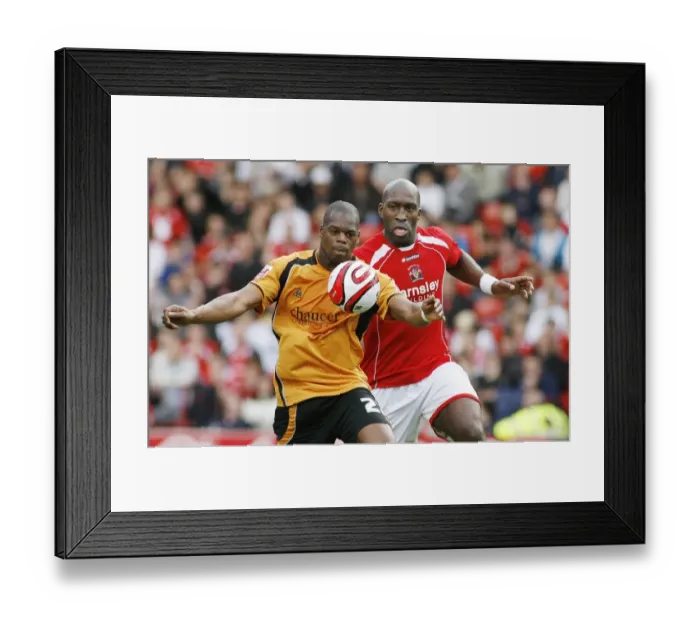 Framed Print : Intense Rivalry: Harewood vs Moore Clash at Barnsley vs Wolverhampton Wanderers Championship Match, 2009