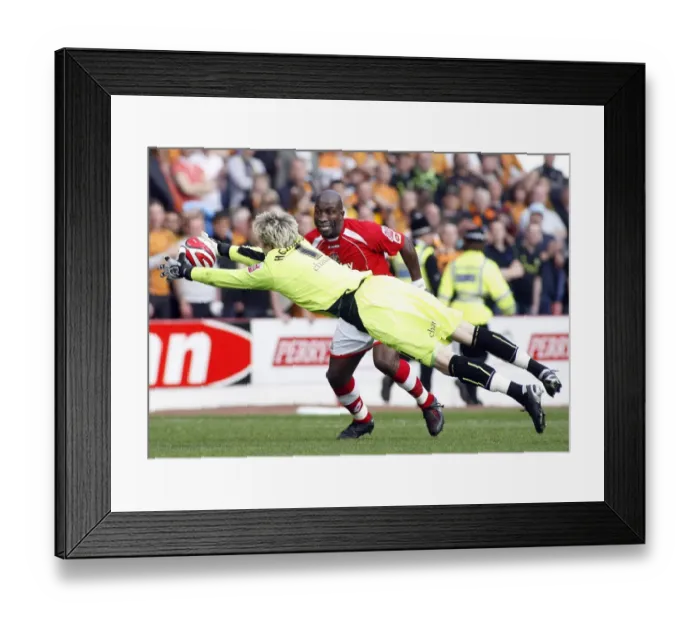 Framed Print : Hennessey vs Moore: Clash between Wolverhampton Wanderers and Barnsley Goalkeepers in Championship Match, 2009