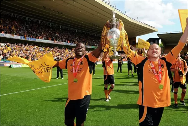 Wolverhampton Wanderers: George Elokobi and Michael Kightly Celebrate Championship Promotion with the Trophy