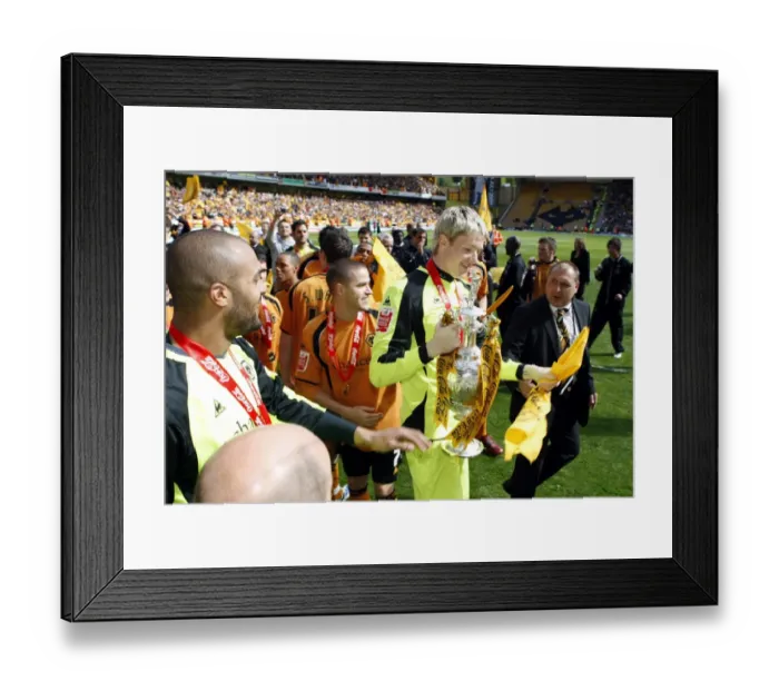 Framed Print : Wolverhampton Wanderers: Wayne Hennessey's Triumphant Moment with the Championship Trophy (2008-09)