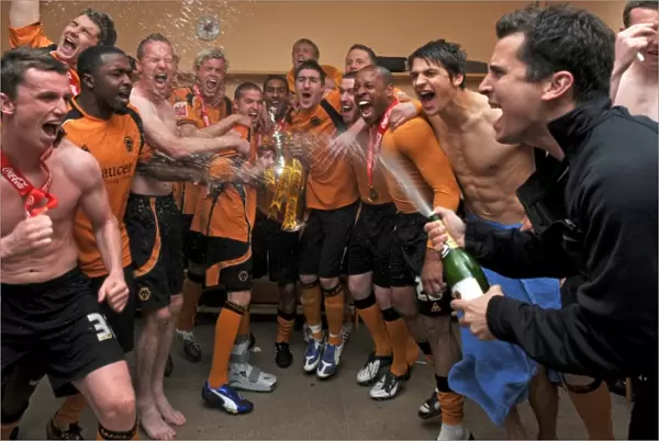 Players of Wolverhampton Wanderers celebrate with the trophy after winning the Coca Cola Football League Championship