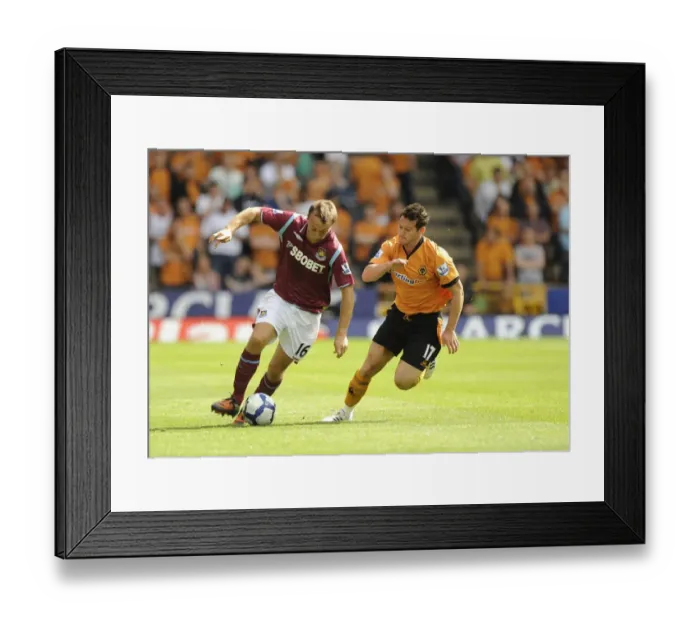 Framed Print : Mark Noble vs. Matthew Jarvis: A Premier League Battle at Molineux, August 15, 2009 Framed Print : Mark Noble vs. Matthew Jarvis: A Premier League Battle at Molineux, August 15, 2009