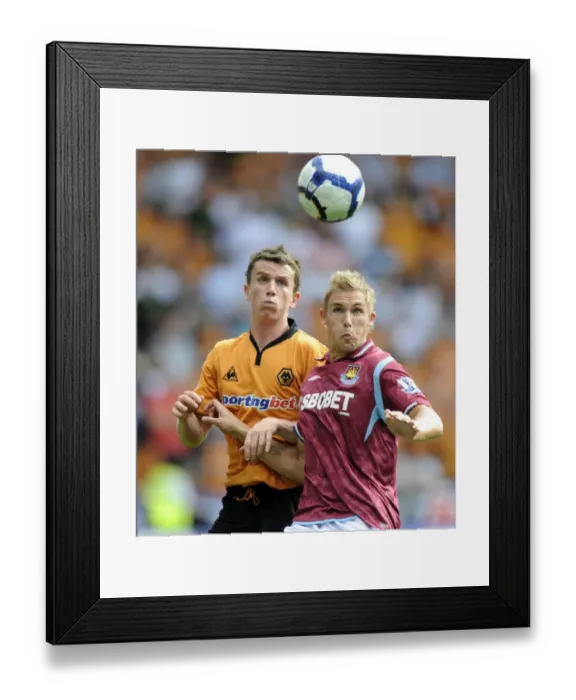 Framed Print : Clash at Molineux: A Premier League Battle - Foley vs Collison (2009) Framed Print : Clash at Molineux: A Premier League Battle - Foley vs Collison (2009)