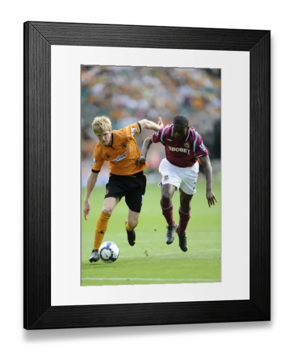Framed Print : Clash at Molineux: Andy Keogh vs Frank Nouble - Barclays Premier League Showdown, August 15, 2009 Framed Print : Clash at Molineux: Andy Keogh vs Frank Nouble - Barclays Premier League Showdown, August 15, 2009