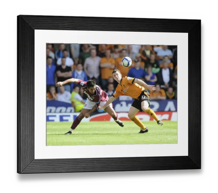 Framed Print : Wolves vs West Ham: Luis Jimenez vs Kevin Foley - Intense Clash at Molineux, Premier League 2009-09 Framed Print : Wolves vs West Ham: Luis Jimenez vs Kevin Foley - Intense Clash at Molineux, Premier League 2009-09