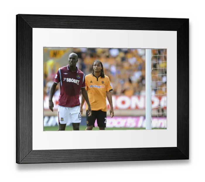 Framed Print : Michael Mancienne Marks Carlton Cole: A Battle at Molineux (Wolves vs West Ham BPL Clash, August 15, 2009) Framed Print : Michael Mancienne Marks Carlton Cole: A Battle at Molineux (Wolves vs West Ham BPL Clash, August 15, 2009)