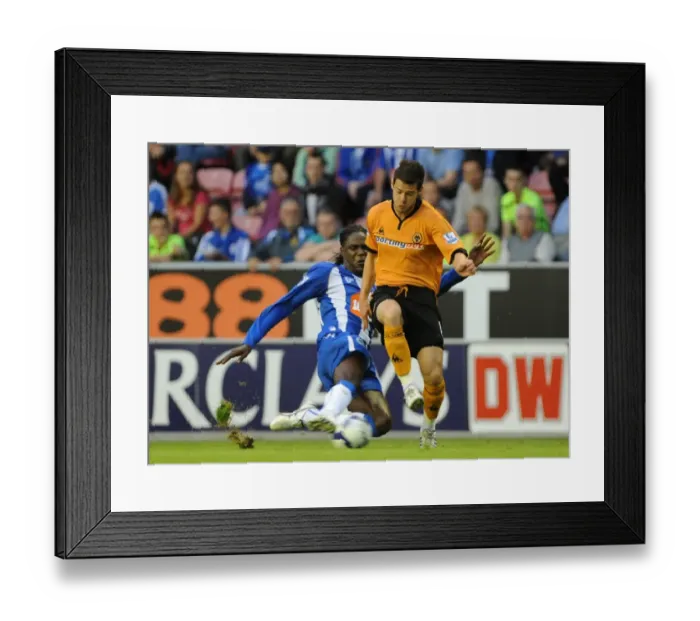 Framed Print : Matthew Jarvis vs Mario Melchiot: Intense Clash Between Wolverhampton Wanderers and Wigan Athletic, Barclays Premier League, August 18, 2009 - DW Stadium Framed Print : Matthew Jarvis vs Mario Melchiot: Intense Clash Between Wolverhampton Wanderers and Wigan Athletic, Barclays Premier League, August 18, 2009 - DW Stadium