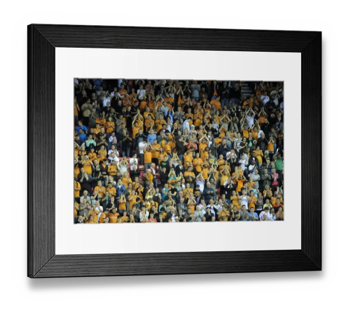 Framed Print : Four Thousand Strong: Wolverhampton Wanderers Unwavering Support at Wigan Athletic's DW Stadium (BPL: Wigan Athletic vs Wolves, August 18, 2009)