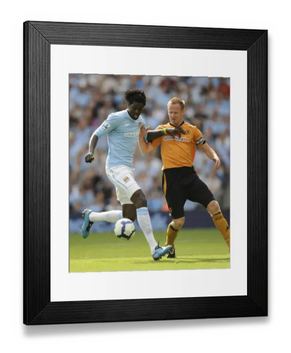 Framed Print : Adebayor vs. Craddock: Manchester City vs. Wolverhampton Wanderers Clash (2009, BPL) Framed Print : Adebayor vs. Craddock: Manchester City vs. Wolverhampton Wanderers Clash (2009, BPL)