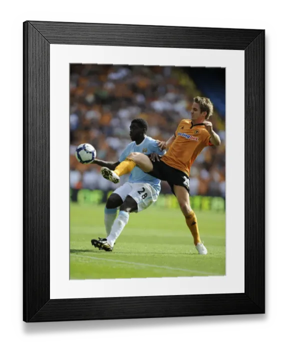 Framed Print : A Clash of Titans: Kolo Toure vs. Kevin Doyle - Manchester City vs. Wolverhampton Wanderers (2009) Framed Print : A Clash of Titans: Kolo Toure vs. Kevin Doyle - Manchester City vs. Wolverhampton Wanderers (2009)