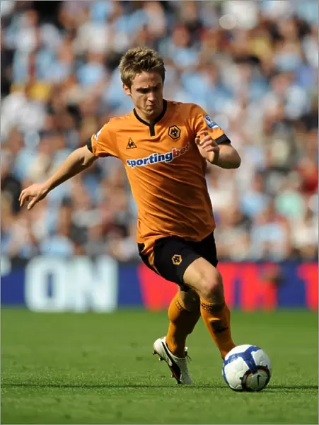 Kevin Doyle at City of Manchester Stadium: A Determined Moment for Wolverhampton Wanderers Against Manchester City (Premier League, 22 / 08 / 09)
