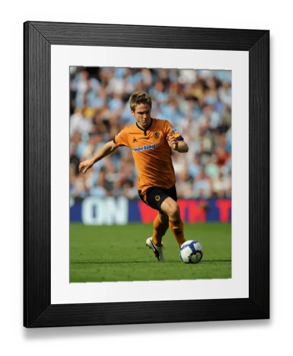 Framed Print : Kevin Doyle at City of Manchester Stadium: A Determined Moment for Wolverhampton Wanderers Against Manchester City (Premier League, 22 / 08 / 09)