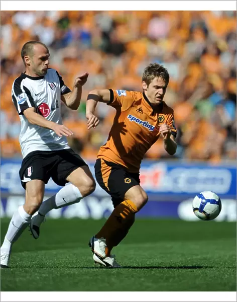 Clash between Kevin Doyle and Danny Murphy: A Intense Moment in Wolverhampton Wanderers vs Fulham Premier League Encounter