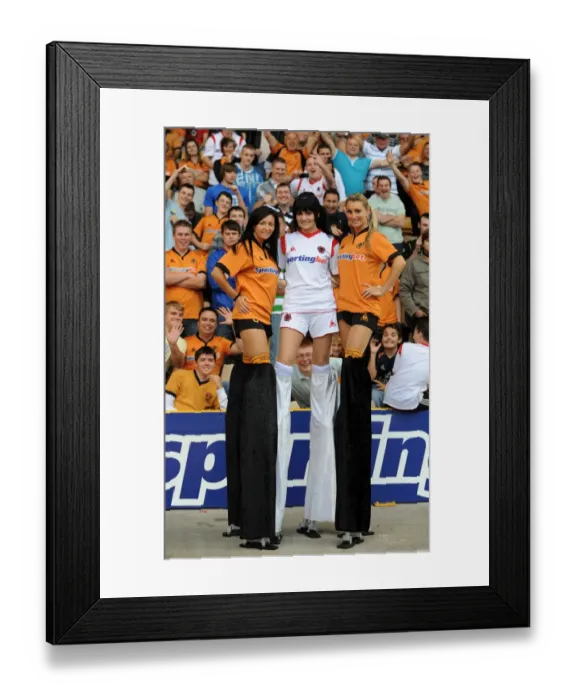 Framed Print : Girls on Stilts: A Unique Twist to Wolverhampton Wanderers vs Fulham Premier League Showdown