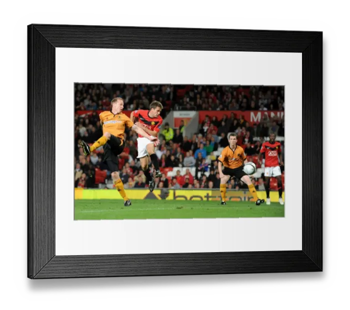 Framed Print : Michael Owen vs Jody Craddock: A Carling Cup Showdown - Manchester United vs Wolverhampton Wanderers: Clash of the Titans