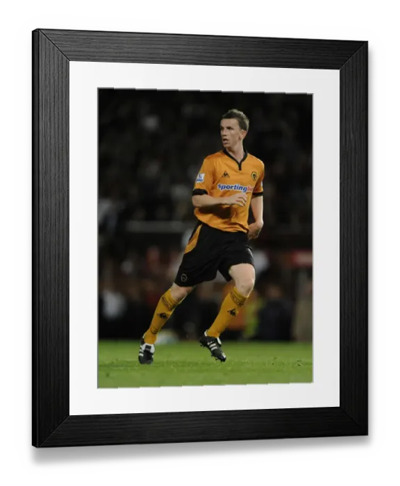 Framed Print : Determined Defiance: Kevin Foley's Challenge Against Manchester United in Carling Cup