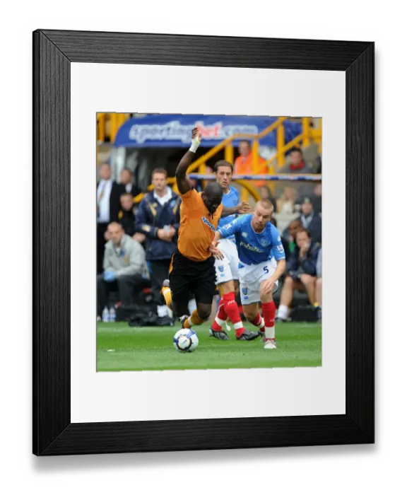 Framed Print : Clash of the Titans: Elokobi vs. O'Hara in Wolverhampton Wanderers vs. Portsmouth Barclays Premier League Showdown Framed Print : Clash of the Titans: Elokobi vs. O'Hara in Wolverhampton Wanderers vs. Portsmouth Barclays Premier League Showdown