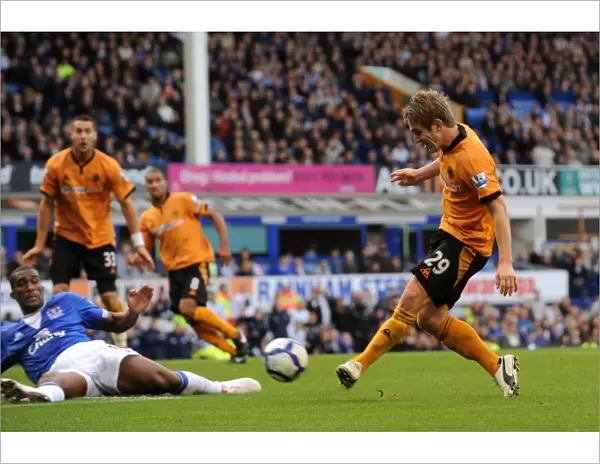 Determined Strike: Kevin Doyle's Premier League Shot Against Everton (Wolverhampton Wanderers)
