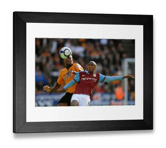 Framed Print : Midlands Rivalry: Ashley Young vs. Ronald Zubar Clash in Premier League Soccer - Wolves vs. Aston Villa
