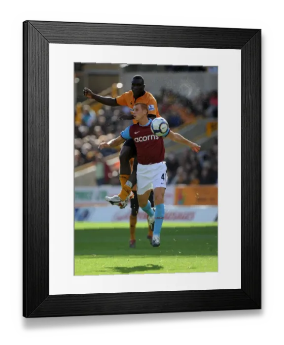 Framed Print : Clash of the Midfield: Segundo Castillo vs. Steve Sidwell in Wolverhampton Wanderers vs. Aston Villa (Premier League) Framed Print : Clash of the Midfield: Segundo Castillo vs. Steve Sidwell in Wolverhampton Wanderers vs. Aston Villa (Premier League)