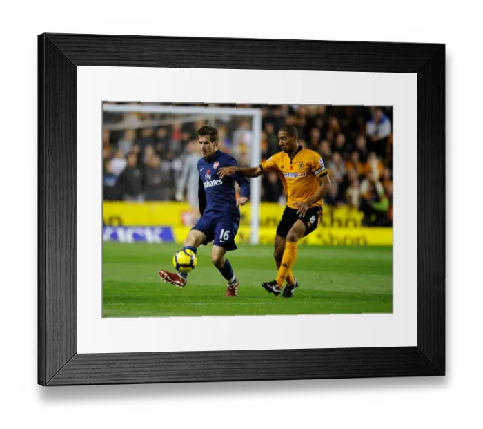 Framed Print : Intense Rivalry: Aaron Ramsey vs. Karl Henry Clash in Wolverhampton Wanderers vs. Arsenal Premier League Soccer Match Framed Print : Intense Rivalry: Aaron Ramsey vs. Karl Henry Clash in Wolverhampton Wanderers vs. Arsenal Premier League Soccer Match