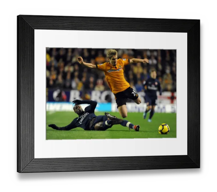 Framed Print : Wolverhampton Wanderers vs Arsenal: A Premier League Battle - Doyle vs Gallas