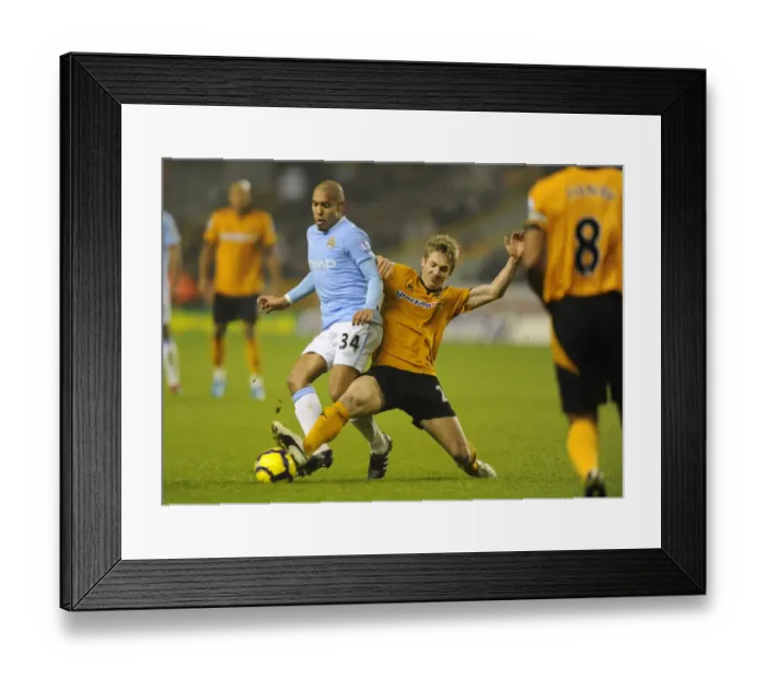 Framed Print : Clash of Titans: Nigel de Jong vs. Kevin Doyle - Wolverhampton Wanderers vs. Manchester City Framed Print : Clash of Titans: Nigel de Jong vs. Kevin Doyle - Wolverhampton Wanderers vs. Manchester City