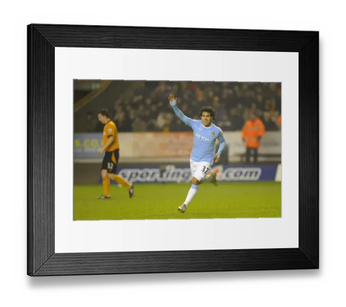 Framed Print : Carlos Tevez's Goal Celebration: Manchester City Takes the Lead over Wolverhampton Wanderers in Premier League Soccer Match Framed Print : Carlos Tevez's Goal Celebration: Manchester City Takes the Lead over Wolverhampton Wanderers in Premier League Soccer Match