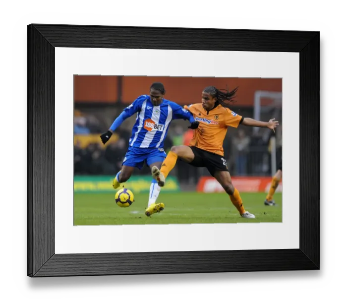 Framed Print : Wolverhampton Wanderers vs Wigan Athletic: A Premier League Showdown - Rodallega vs Mancienne Framed Print : Wolverhampton Wanderers vs Wigan Athletic: A Premier League Showdown - Rodallega vs Mancienne