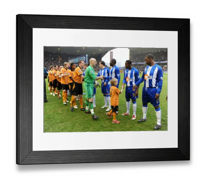 Framed Print : Thrilling Mascot Showdown: Wolverhampton Wanderers vs Wigan Athletic - Barclays Premier League Framed Print : Thrilling Mascot Showdown: Wolverhampton Wanderers vs Wigan Athletic - Barclays Premier League