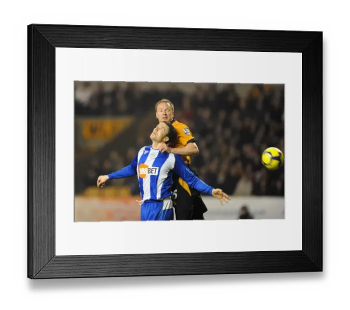 Framed Print : Wolverhampton Wanderers vs Wigan Athletic: A Premier League Battle - Craddock vs Caldwell