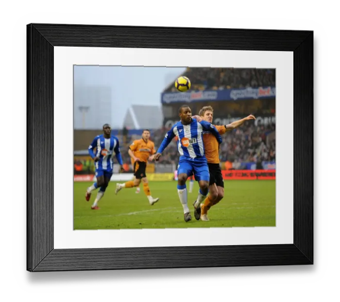 Framed Print : Clash of the Strikers: Titus Bramble vs. Kevin Doyle - Wolverhampton Wanderers vs. Wigan Athletic in the Barclays Premier League